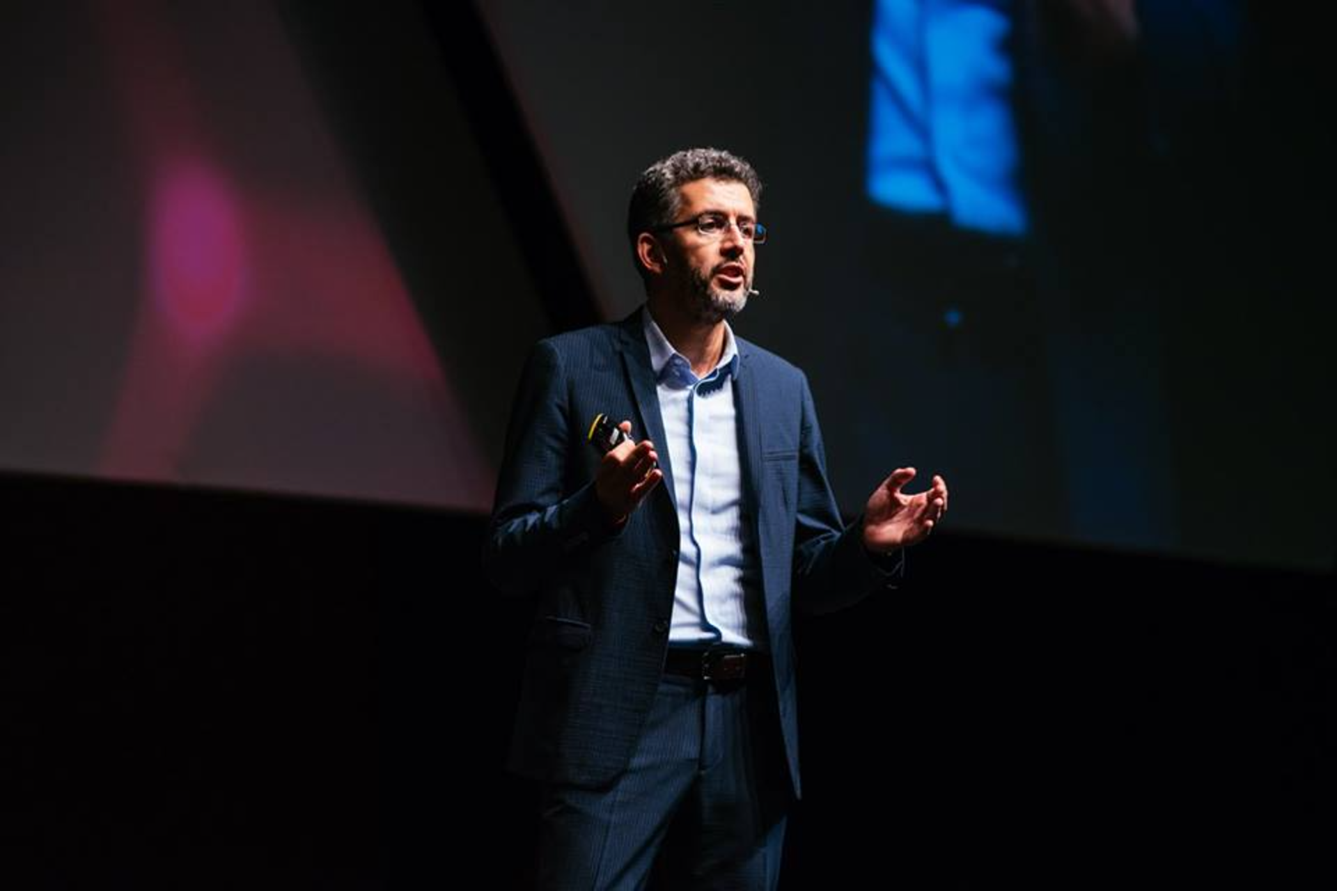 Burak Dayioglu speaking on stage